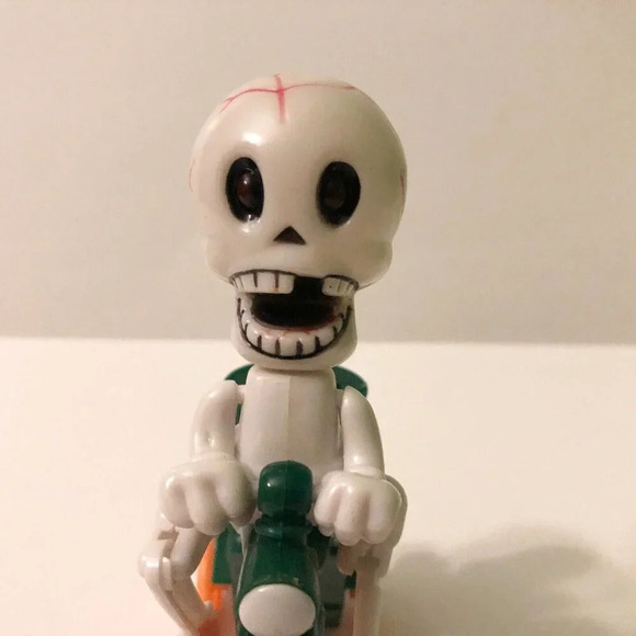 Halloween Plastic Skeleton Riding Bicycle Bike Lollipop Candy Holder Wind Up Toy - Picture 2 of 10